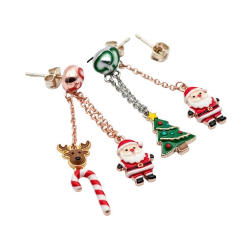 Mismatched earrings featuring stars and moons with glitter enamel